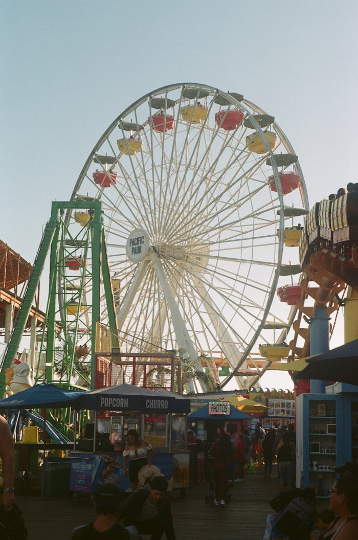 Services-02 Capture the vibrant atmosphere at Santa Monica Pier with the iconic Ferris wheel and bustling crowd.
